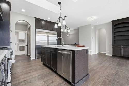 9 Kingsbridge Place Se, Airdrie, AB - Indoor Photo Showing Kitchen With Upgraded Kitchen