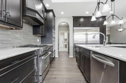9 Kingsbridge Place Se, Airdrie, AB - Indoor Photo Showing Kitchen With Upgraded Kitchen