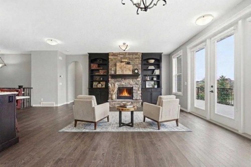 9 Kingsbridge Place Se, Airdrie, AB - Indoor Photo Showing Living Room With Fireplace