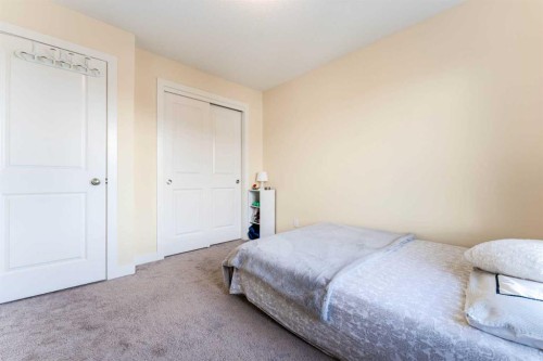 1402 Jumping Pound Common, Cochrane, AB - Indoor Photo Showing Bedroom