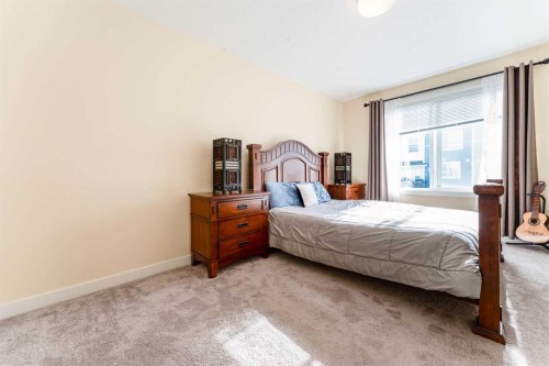 1402 Jumping Pound Common, Cochrane, AB - Indoor Photo Showing Bedroom
