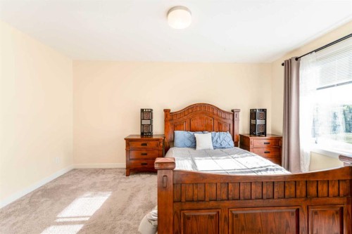 1402 Jumping Pound Common, Cochrane, AB - Indoor Photo Showing Bedroom