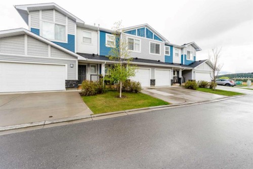 1402 Jumping Pound Common, Cochrane, AB - Outdoor With Facade