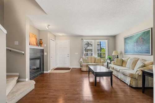 249 Elgin Meadows Park Se, Calgary, AB - Indoor Photo Showing Living Room With Fireplace