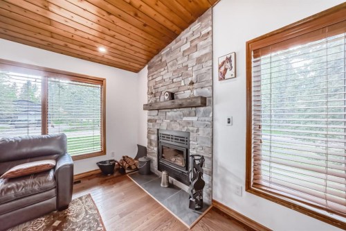 2 Wolf Close, Rural Rocky View County, AB - Indoor Photo Showing Living Room With Fireplace