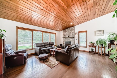 2 Wolf Close, Rural Rocky View County, AB - Indoor Photo Showing Living Room With Fireplace