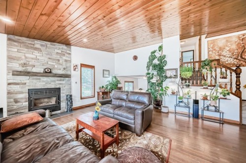2 Wolf Close, Rural Rocky View County, AB - Indoor Photo Showing Living Room With Fireplace