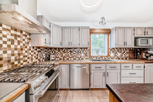 2 Wolf Close, Rural Rocky View County, AB - Indoor Photo Showing Kitchen With Stainless Steel Kitchen With Double Sink