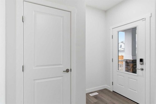 90 Saddlebred Place, Cochrane, AB - Indoor Photo Showing Other Room With Fireplace