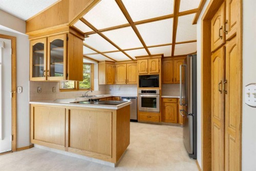 23 Millside Place Sw, Calgary, AB - Indoor Photo Showing Kitchen With Double Sink