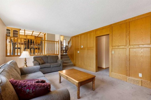 23 Millside Place Sw, Calgary, AB - Indoor Photo Showing Living Room