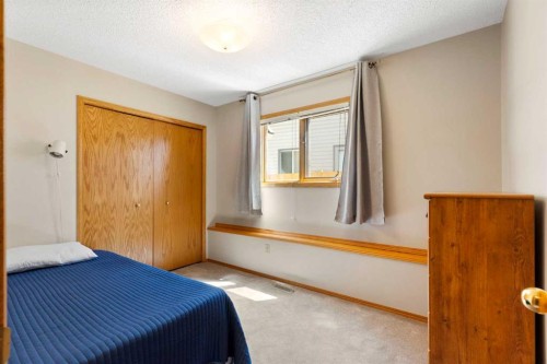 23 Millside Place Sw, Calgary, AB - Indoor Photo Showing Bedroom