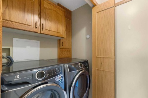 23 Millside Place Sw, Calgary, AB - Indoor Photo Showing Laundry Room