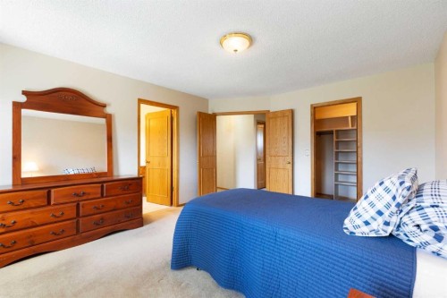 23 Millside Place Sw, Calgary, AB - Indoor Photo Showing Bedroom