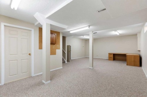 23 Millside Place Sw, Calgary, AB - Indoor Photo Showing Basement
