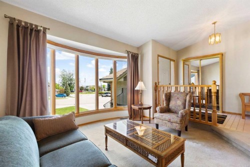 23 Millside Place Sw, Calgary, AB - Indoor Photo Showing Living Room