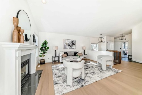 161 West Creek Pond, Chestermere, AB - Indoor Photo Showing Living Room With Fireplace