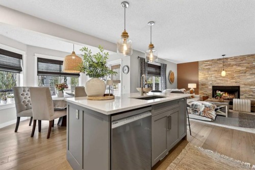 37 Shawbrooke Manor Sw, Calgary, AB - Indoor Photo Showing Kitchen With Fireplace