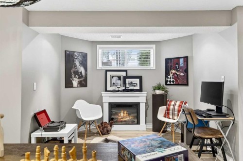 37 Shawbrooke Manor Sw, Calgary, AB - Indoor With Fireplace
