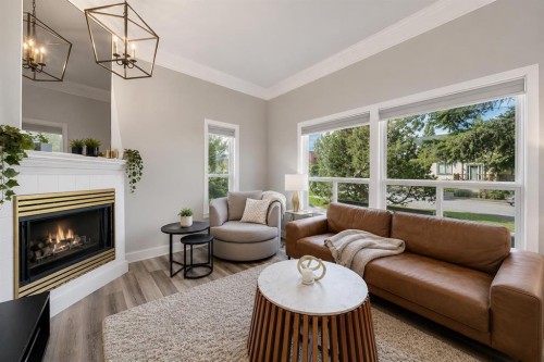 107 Mission Road Sw, Calgary, AB - Indoor Photo Showing Living Room With Fireplace