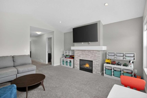 42 Baysprings Way Sw, Airdrie, AB - Indoor Photo Showing Living Room With Fireplace