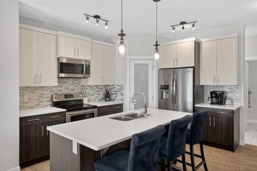 42 Baysprings Way Sw, Airdrie, AB - Indoor Photo Showing Kitchen With Stainless Steel Kitchen With Double Sink With Upgraded Kitchen