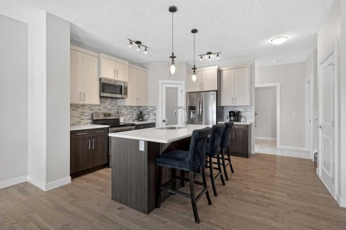 42 Baysprings Way Sw, Airdrie, AB - Indoor Photo Showing Kitchen With Stainless Steel Kitchen With Upgraded Kitchen
