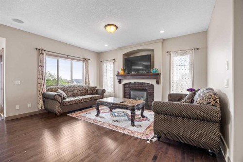 282 Pantego Terrace Nw, Calgary, AB - Indoor Photo Showing Living Room With Fireplace
