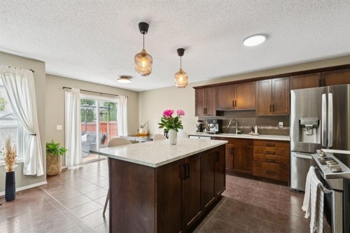 943 Windsong Drive Sw, Airdrie, AB - Indoor Photo Showing Kitchen With Stainless Steel Kitchen