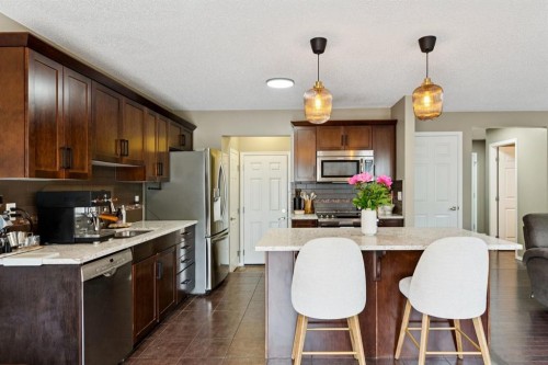 943 Windsong Drive Sw, Airdrie, AB - Indoor Photo Showing Kitchen With Stainless Steel Kitchen
