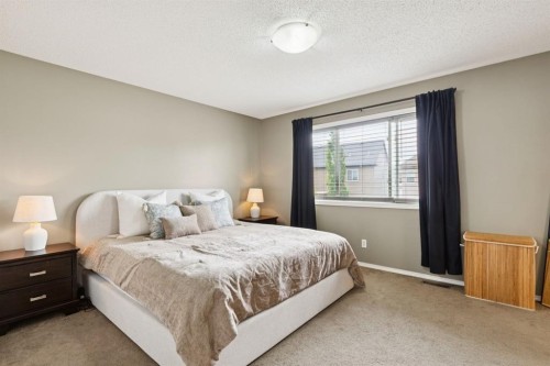 943 Windsong Drive Sw, Airdrie, AB - Indoor Photo Showing Bedroom