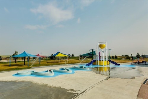 943 Windsong Drive Sw, Airdrie, AB - Outdoor With In Ground Pool