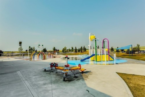 943 Windsong Drive Sw, Airdrie, AB - Outdoor With In Ground Pool