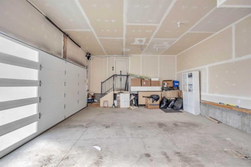 97 Baysprings Gardens Sw, Airdrie, AB - Indoor Photo Showing Garage