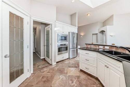 35 Arbour Vista Way Nw, Calgary, AB - Indoor Photo Showing Kitchen With Double Sink