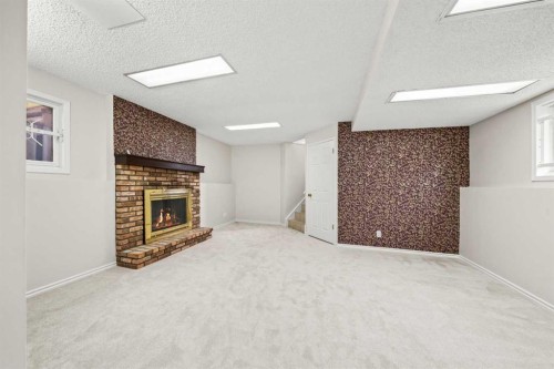 107 Tararidge Close Ne, Calgary, AB - Indoor With Fireplace