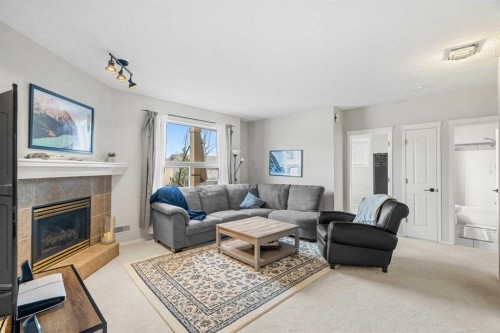 94 Edgebrook Heights Nw, Calgary, AB - Indoor Photo Showing Living Room With Fireplace