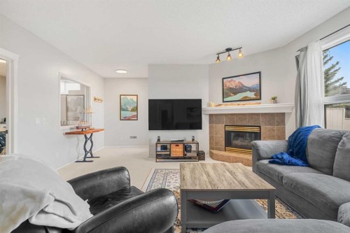94 Edgebrook Heights Nw, Calgary, AB - Indoor Photo Showing Living Room With Fireplace
