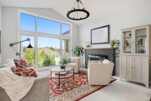 94 Edgebrook Heights Nw, Calgary, AB - Indoor Photo Showing Living Room With Fireplace
