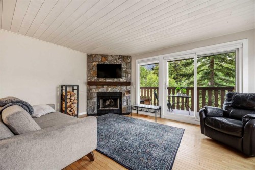 1-1061 Evergreen Circle, Canmore, AB - Indoor Photo Showing Living Room With Fireplace