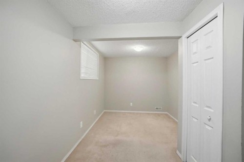 35 Saddlebrook Link Ne, Calgary, AB - Indoor Photo Showing Other Room