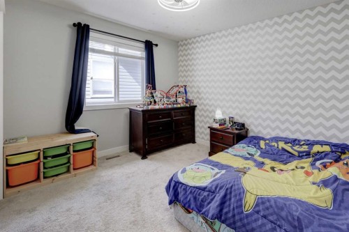 5 Williamstown Park Nw, Airdrie, AB - Indoor Photo Showing Bedroom