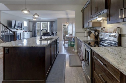 5 Williamstown Park Nw, Airdrie, AB - Indoor Photo Showing Kitchen With Upgraded Kitchen