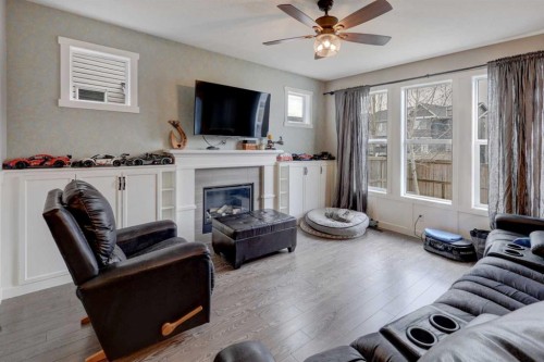 5 Williamstown Park Nw, Airdrie, AB - Indoor Photo Showing Living Room With Fireplace