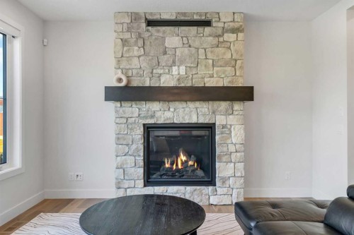 236 Marina Grove Se, Calgary, AB - Indoor Photo Showing Living Room With Fireplace