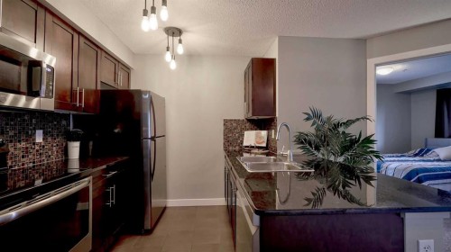3309-403 Mackenzie Way Sw, Airdrie, AB 