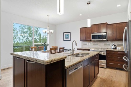 114 Cougarstone Crescent Sw, Calgary, AB - Indoor Photo Showing Kitchen With Double Sink With Upgraded Kitchen