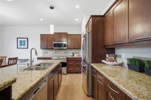 114 Cougarstone Crescent Sw, Calgary, AB - Indoor Photo Showing Kitchen With Double Sink With Upgraded Kitchen
