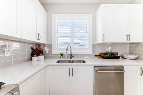 116 Precedence Way, Cochrane, AB - Indoor Photo Showing Kitchen With Double Sink