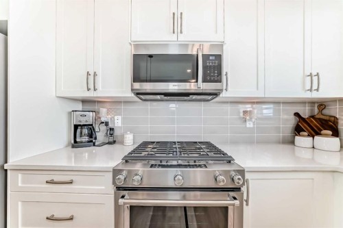 116 Precedence Way, Cochrane, AB - Indoor Photo Showing Kitchen With Upgraded Kitchen